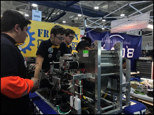 student working on robot 